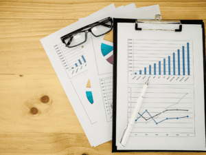 graphs and glasses on table