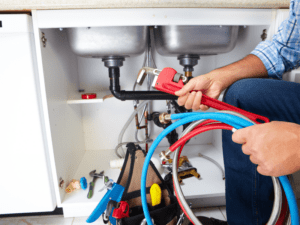 plumber fixing sink